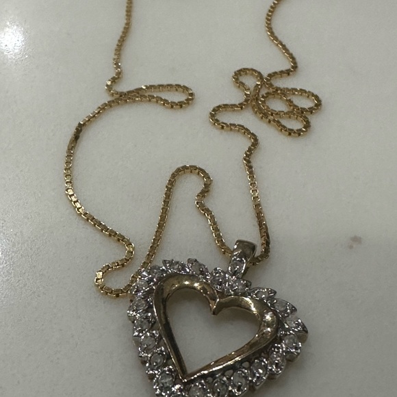 This is a yellow gold open heart diamond pendant necklace on a gold chain - Picture 3 of 8